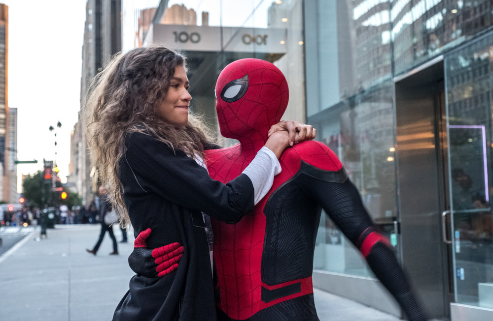 Michelle (Zendaya) catches a ride from Spider-Man (Tom Holland) in Spider-Man: Far From Home