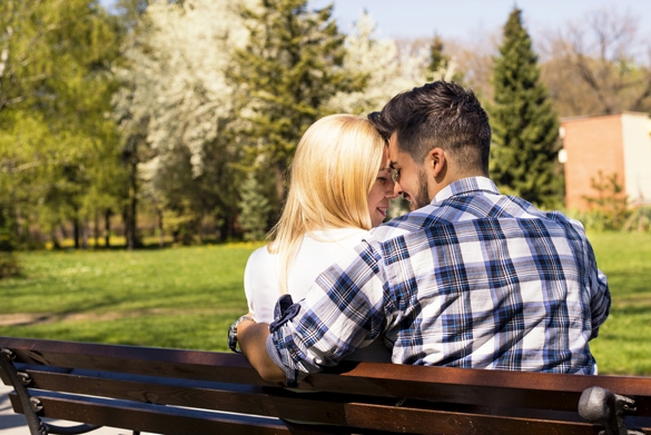 Beautiful loving couple flirting in the park on beautiful sunny day - Signs a Gemini Man Is Falling In Love with You