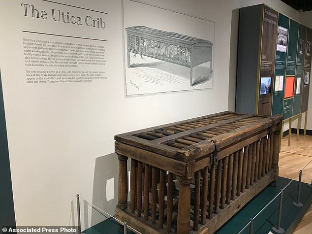 A cage for humans known as the Utica Crib is displayed. Displays tell the stories of how psychology has been used in everything from workplace efficiency to determining the level of caffeine in Coca-Cola