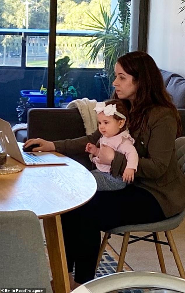 Mrs Rossi (pictured working with her daughter Olympia) revealed to Daily Mail Australia, she has barely left her home since February as her daughter Olympia was just three months old when coronavirus gripped Australia