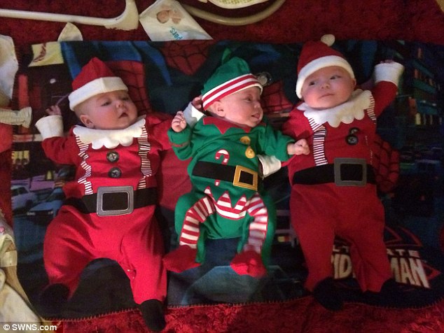 Happy Christmas! The triplets pictured dressed as Santa
