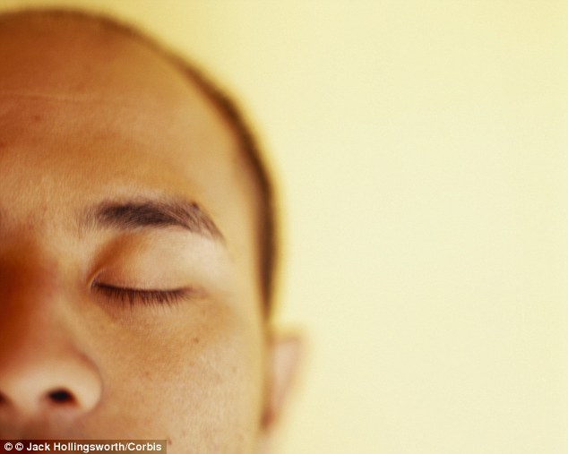 The research team studied 27 men and women who had reported having problems with work due to anxiety or depression. The participants were given a single session of Havening, which involved closing their eyes and thinking about the negative event that was causing the anxiety while their arms were touched (stock image)
