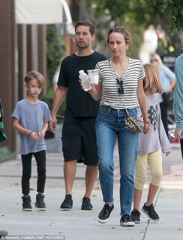 Over: Tobey Maguire and Jennifer Meyer, pictured here with son Otis and daughter Ruby on Sunday, have split after nine years together