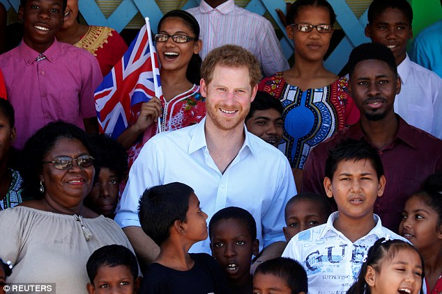 Prince Harry poses for a photo at Joshua House Children