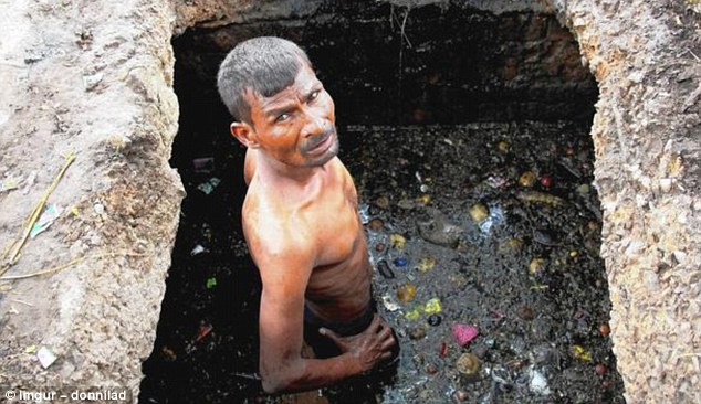 The Imgur user who shared this image said it depicts an Indian sewer worker, who is wearing no protective clothing despite being waist deep in the tunnel