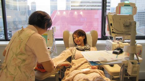 Masako giving blood in hospital