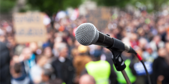 Closeup of a microphone at a protest.