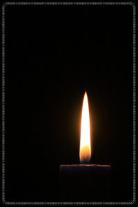 small candlelight with black background.