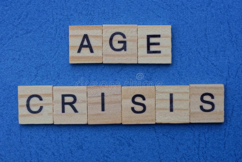 Phrase age crisis made from gray wooden letters. Lies on a blue background stock photos