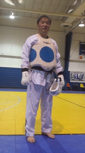 male wearing white Taekwondo attire 