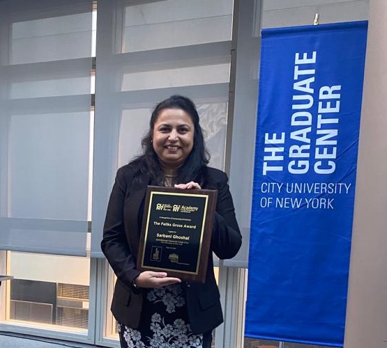 said Dr. Sarbani Ghoshal, Assistant Professor, holding award