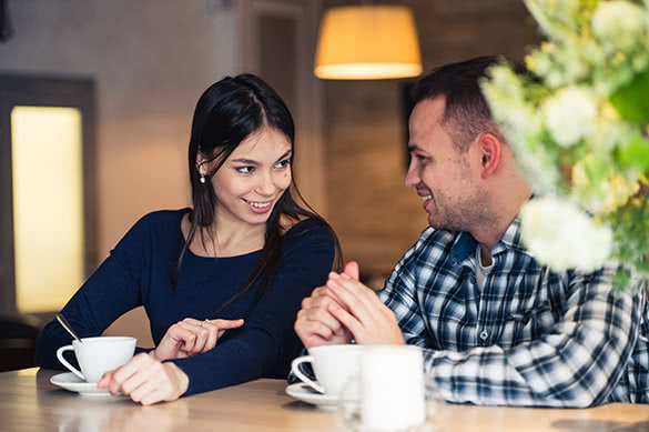 couple talking in a coffee shop